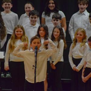 A student from the DeMello School performs a solo. Photo by Kat Sheridan