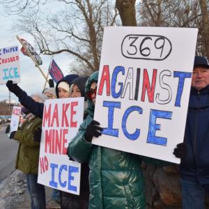 A number of signs protesting I.C.E.