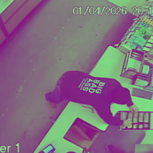 The robber, allegedly Nicholas Ouimet, on camera footage at Walgreens. Source: New Bedford Police Department