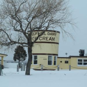 Gulf Hill Dairy surrounded by snow.