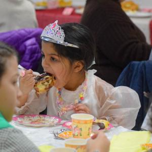Dani Semedo, age 6, enjoys a cinnamon roll.