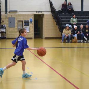 Isabel Poitras dribbles the ball.