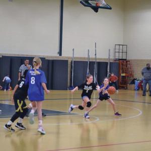 Avery Camara tries to grab the ball from Gabby Jonsaint.