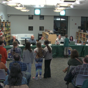 The Invention Convention team gives Silly Soap Stamps to the School Committee. Source: DHSTVmedia