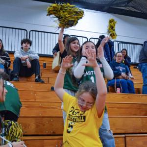 Some of the girls celebrate that the team scored. 