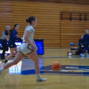 Melanie DeMeo dribbles the ball.