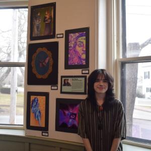 Kai Dixon with his art.