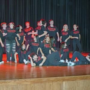 The entire cast pose at the end of  the opening dance.