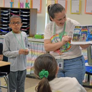 Brittany Travassos examines the photos left by the perpetrator. 