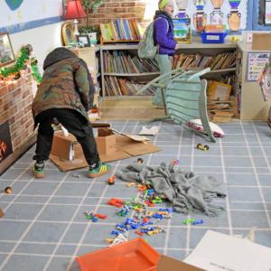 A mess left in the reading section of the classroom.