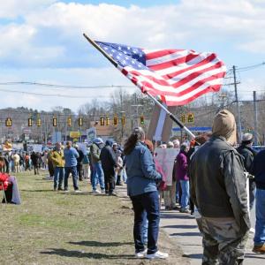 The American flag waves in front of the crowd. Photos by Kat Sheridan