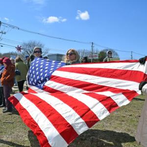 A number of protesters brought a large American flag.