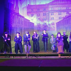 The cast sings about their displeasure of the Communist times they llive in. 