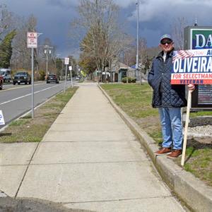 Al Oliveira campaigns outside Town Hall. 