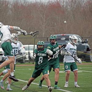 Jack Howarth jumps to pass the ball. Photos by Kat Sheridan