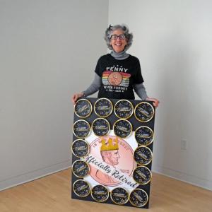 Nancy Franks with her penny retirement sign. Photo by Kat Sheridan