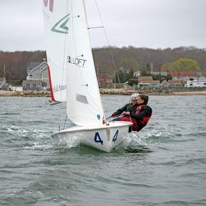 Maisy Sperry and Phoebe Murray lean to steady the boat.