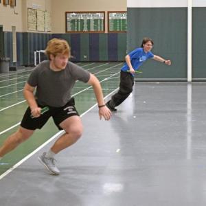 Coach John Breault watches Aidan Gendron race Jason Sullivan. Photos by Kat Sheridan