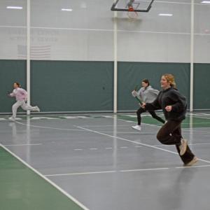 Seniors Kaelyn Zuber, Chace Levasseur, and Emma Garcia lead their teams in the relay race. 