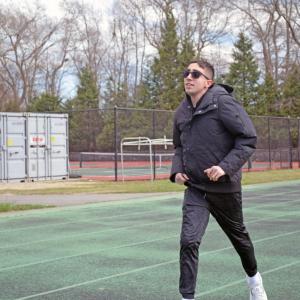 Andrew Camara runs in the 400 meter.