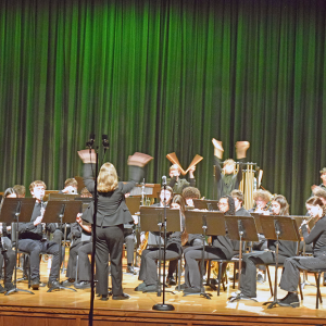 The band encourages the crowd to clap along. 