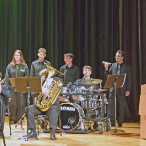 Students play the drums during the band concert. 