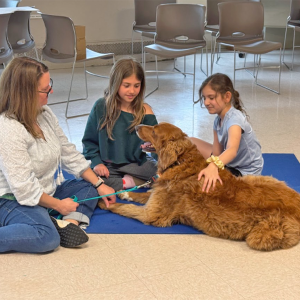 Layla Kruz, age 9 and Vivian Amaral, age 9 pet Enzo. 