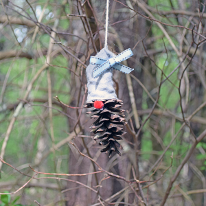A gnome with a bow on their head. 
