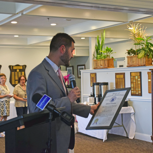 Cody Hadadd reads off some of Jackie McDonald's accomplishments. 