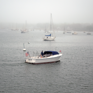 A boat floats past to view the ceremony. 
