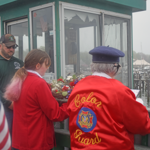 Members of the Color Guard prepare to toss the wreath. 