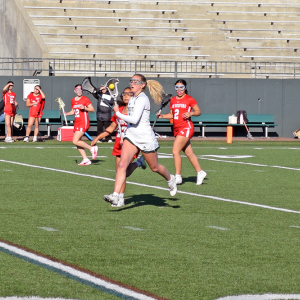 Lily Gangi heads toward the goal with the ball. 