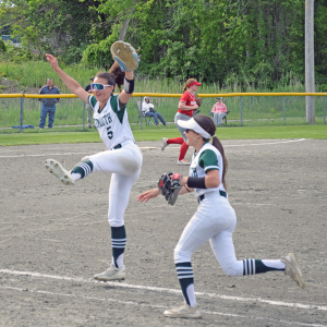 Two players celebrate the end of an inning. Photos by Kat Sheridan