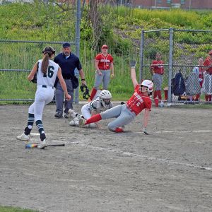 The umpire gets a New Bedford player out. 