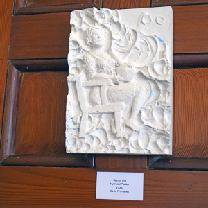A piece featuring a woman. 
