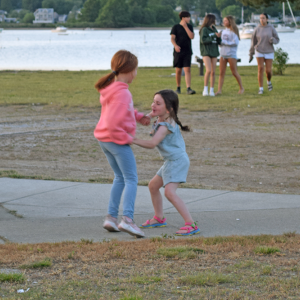 Eliette, 7, and Varou, 5, dance to the music. 