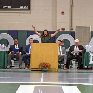 Rachel Lassey cheers for the graduates. 