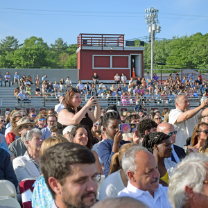 Families capture the moment their family members graduate. 
