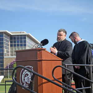 Chaplain Lauren Valliere leads the opening prayer. 