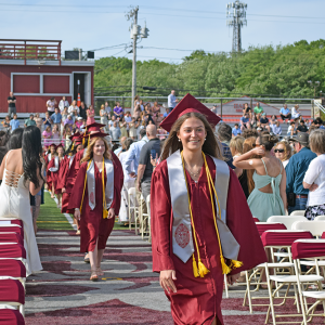 The students enter into the graduation. 