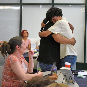 Noah hugs his father thanks. 