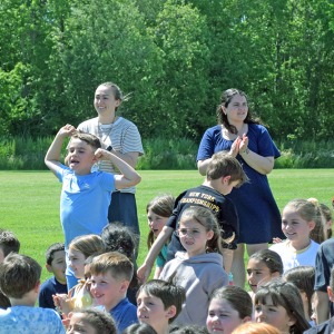 Some students celebrate the opening of the playground. 