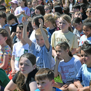 Some students celebrate the opening of the playground. 