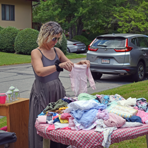 Cheri looks through some goods. 