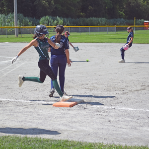 A player runs to first base. 