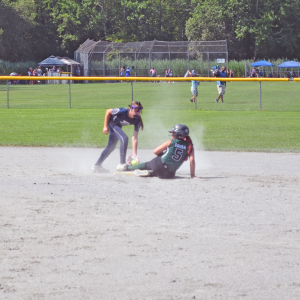 A player slides to base. Photos by Kat Sheridan