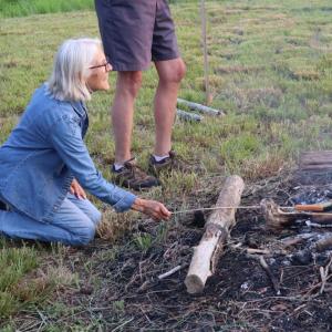 Joney Smith, who is also on the board for the DNRT, enjoys the fire. 