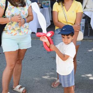 Aiden, 4, with a balloon sword. 