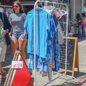 Shirts as a part of a sidewalk sale. 