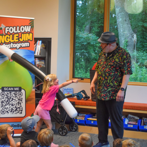 Ivy laughs at Jungle Jim after performing a magic trick. 